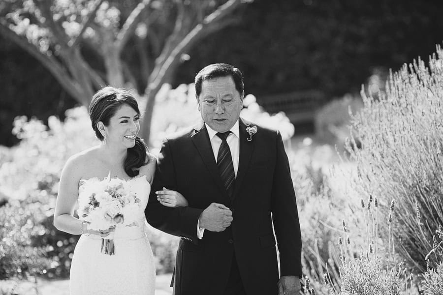 The bride and her father walking down the aisle together