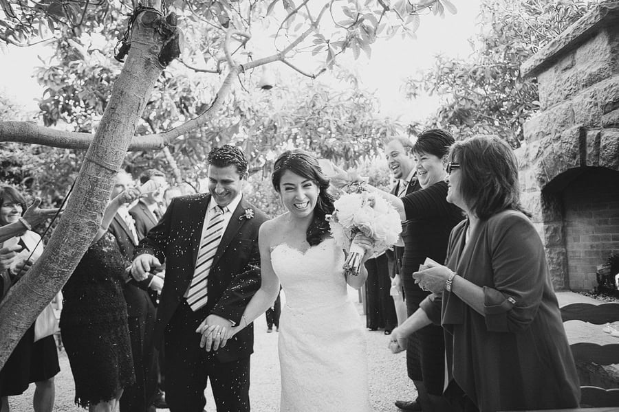 Bride and groom running through lavender