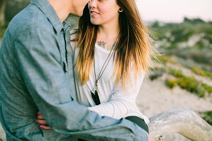 A close up photo of a couple and her tattoos