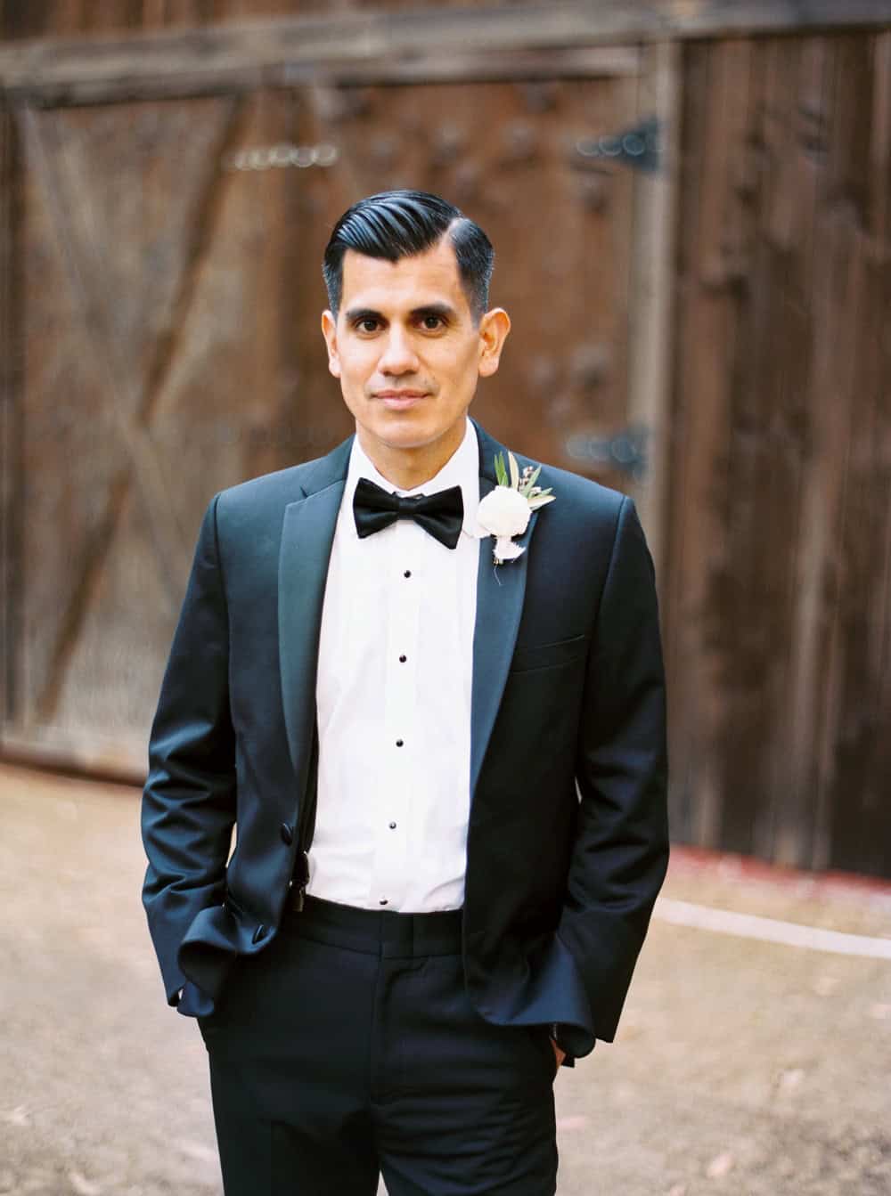 Groom in a black tux 