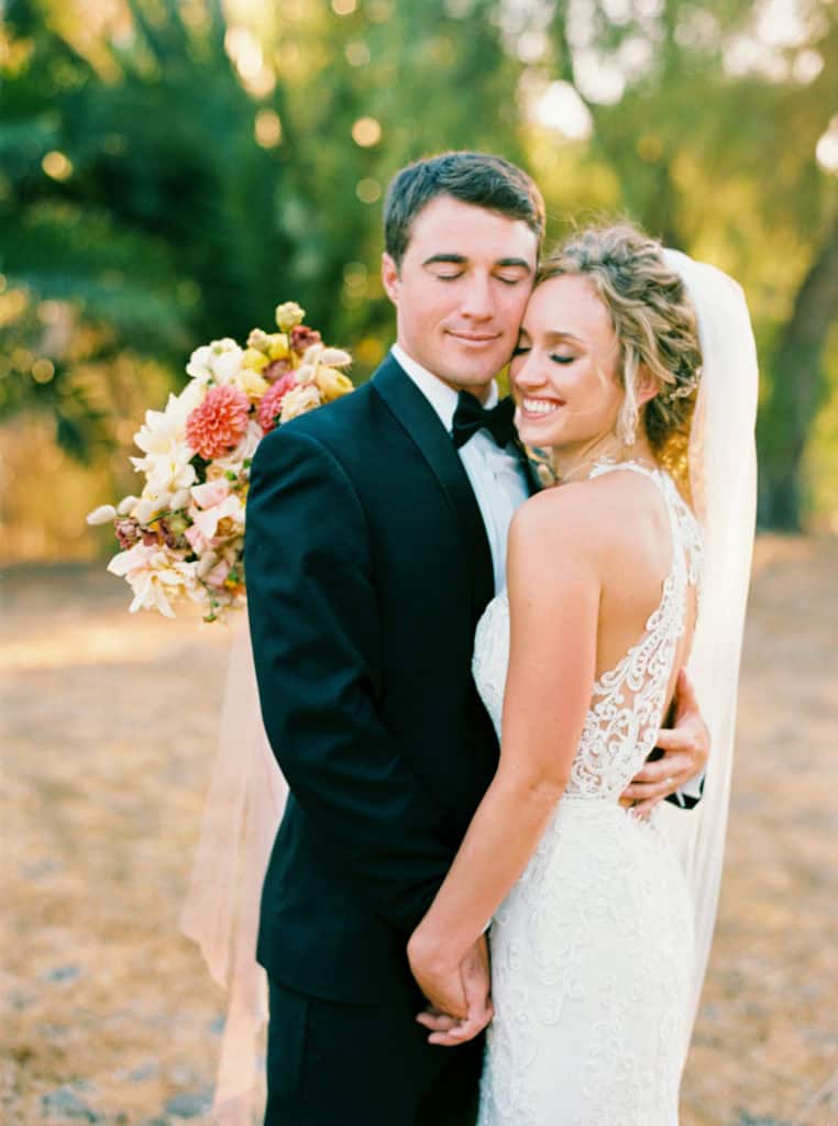 Quiet moment between bride and groom during sunset photos