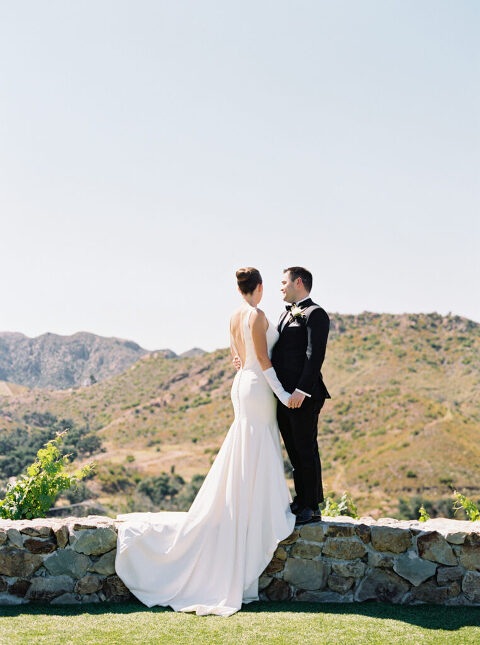 Timeless bride and groom portrait with the scenic Santa Monica Hills in the background. A romantic and elegant wedding moment captured at Cielo Farms in Malibu.