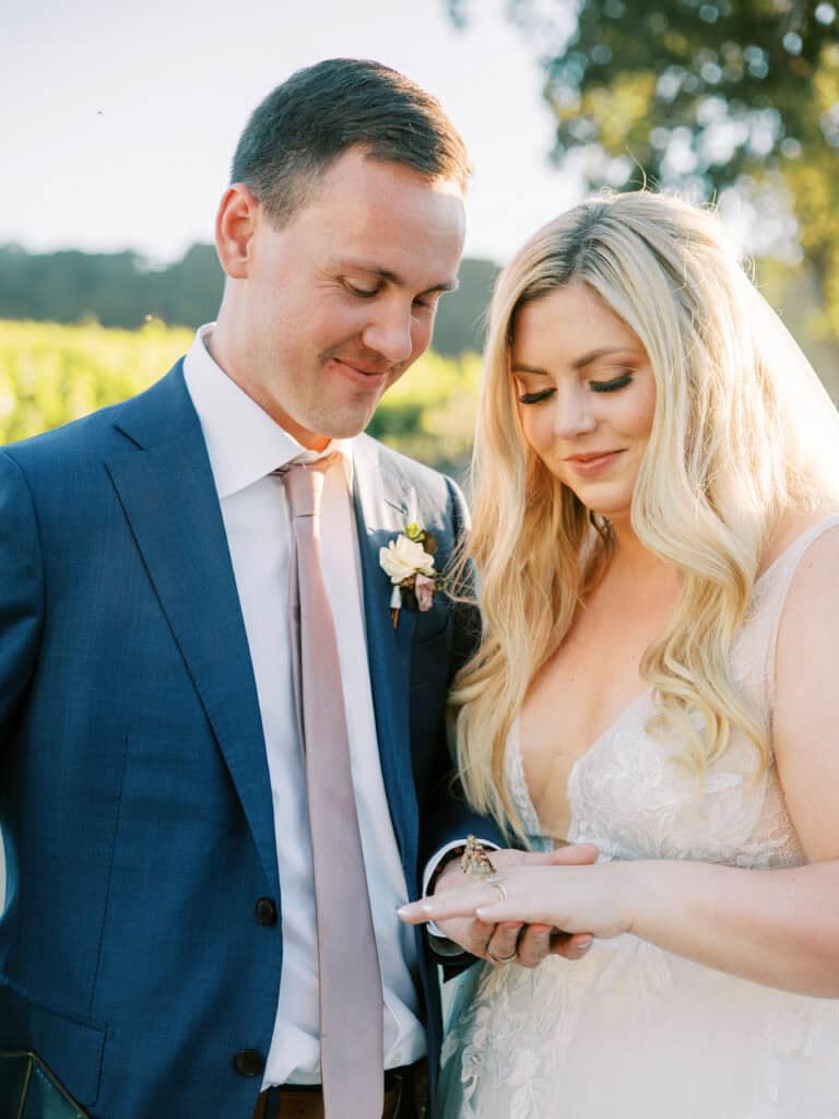 During a butterfly release to honor loved ones, one butterfly gently landed on the bride’s hand and lingered, creating a touching moment.