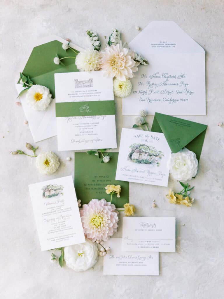 A beautifully designed wedding invitation suite featuring green and white details.