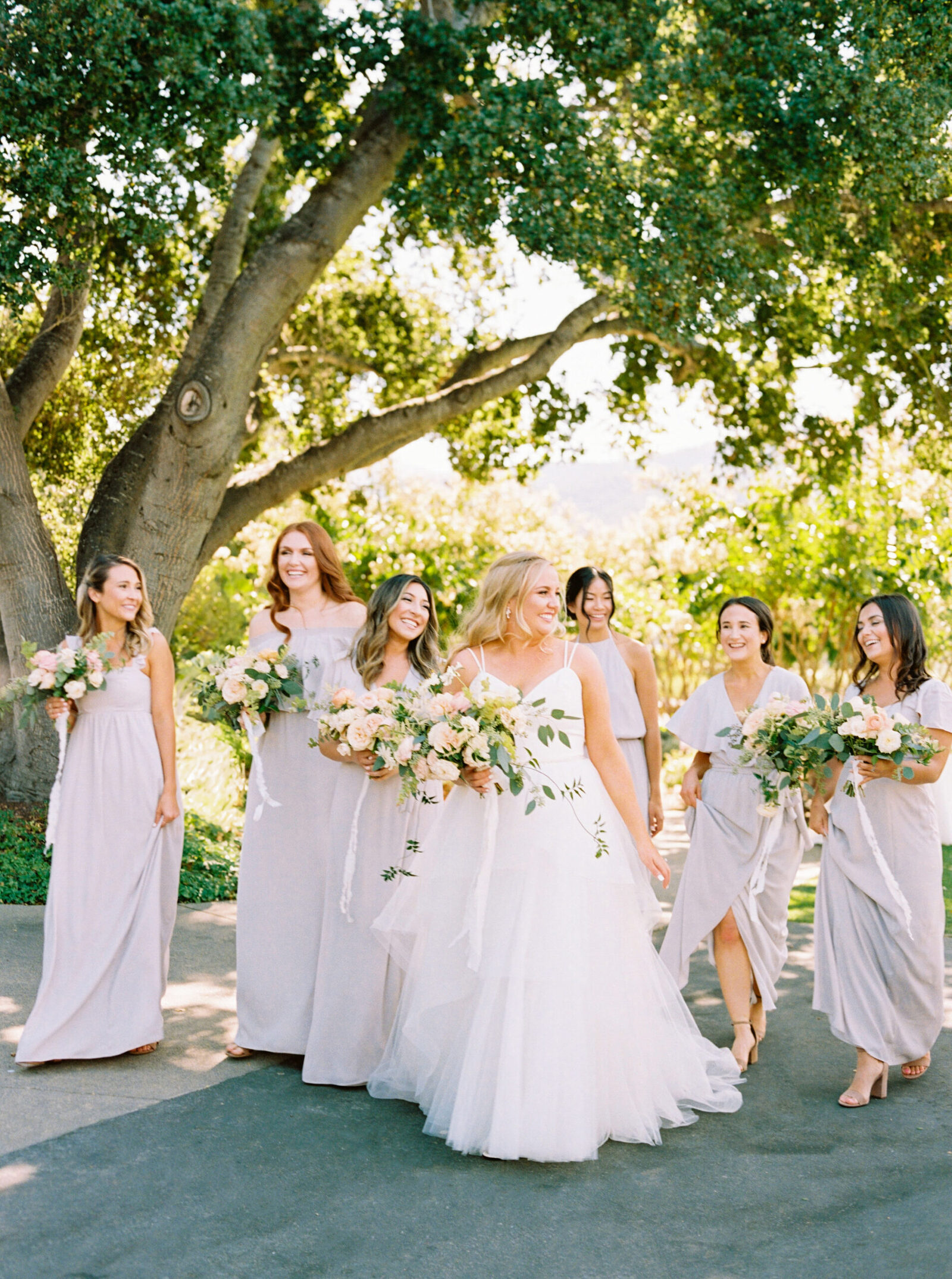 Bride Kelly stands with her bridesmaids in soft lavender dresses at Holman Ranch in Carmel.