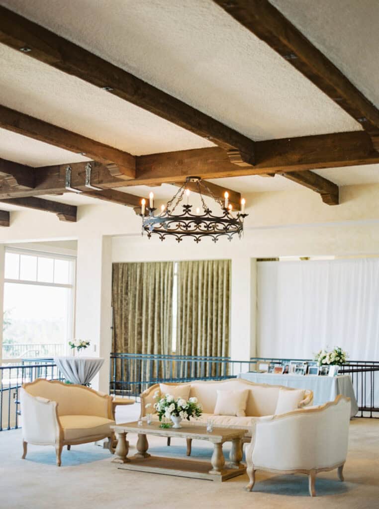 A stylish lounge space with comfortable furniture by Standard Event Rentals, offering guests a chic seating area during cocktail hour.