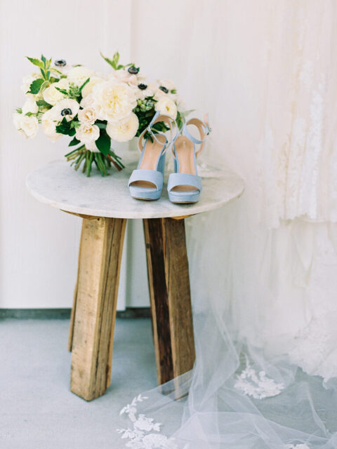 A stunning close-up of Michelle’s all-white bridal bouquet, expertly designed by San Luis Obispo florist Noonan's Wine Country Designs. Lush blooms add timeless elegance to her Greengate Ranch wedding.