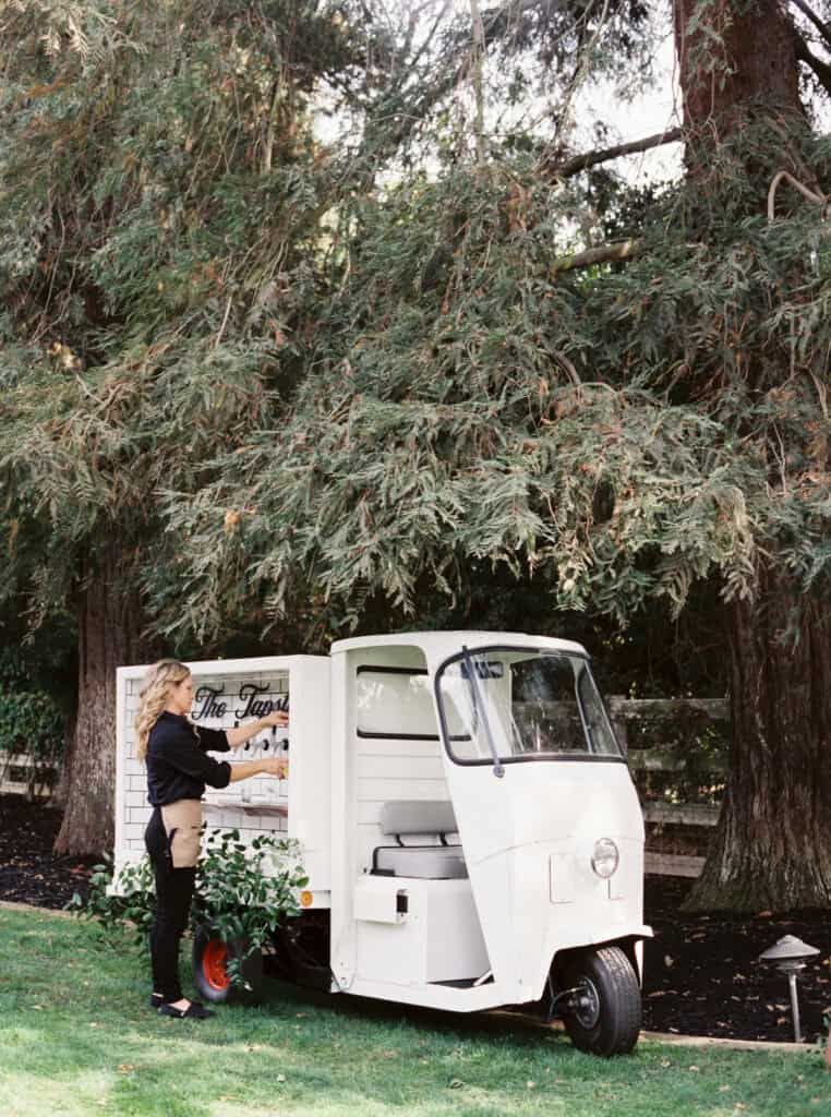 A stylish self-serve beer cart at a wedding reception offering guests a fun and interactive way to enjoy their drinks.