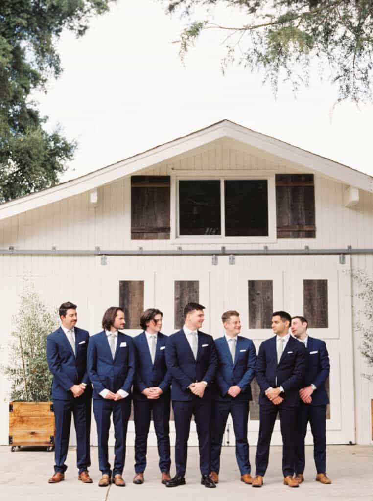 A classic portrait of the groom with his groomsmen, dressed in timeless attire and standing together at the private estate wedding in Lodi, CA.