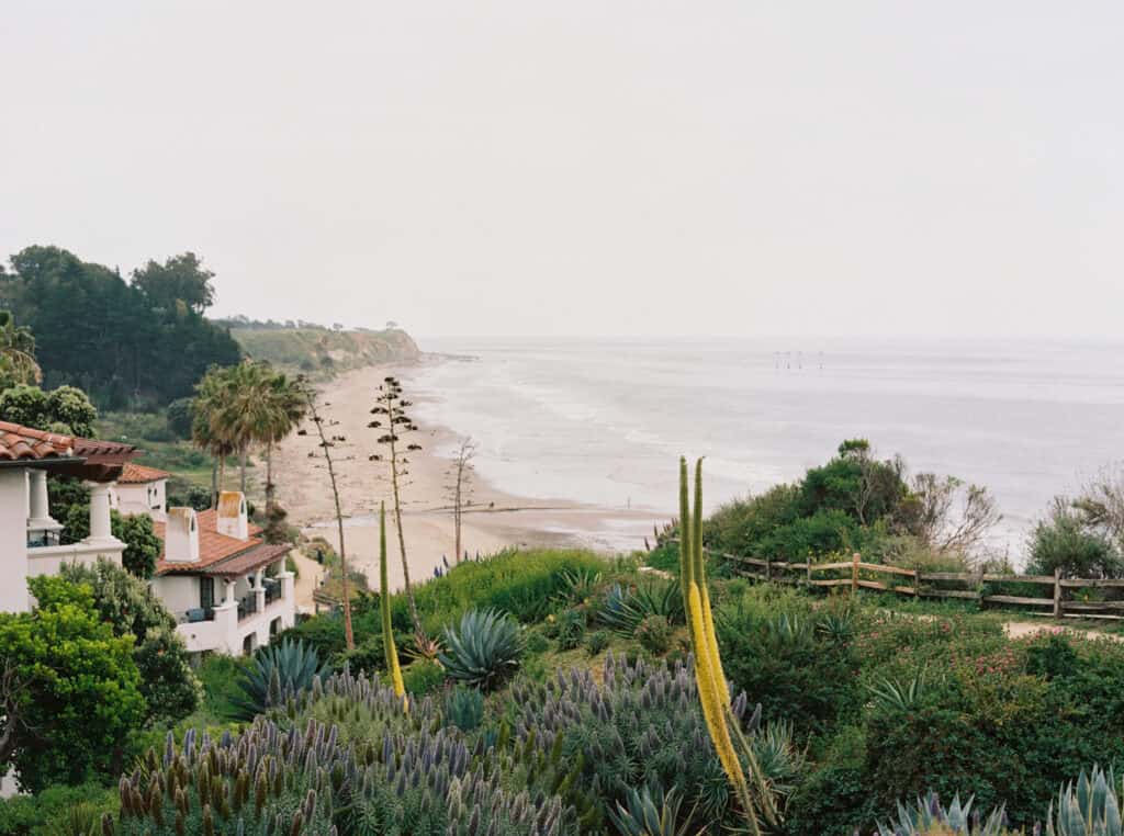 Scenic landscape view of the Santa Barbara coastline from the ceremony lawn at the Bacara Resort, showcasing the stunning ocean and sky, captured by Jen Rodriguez Photography.