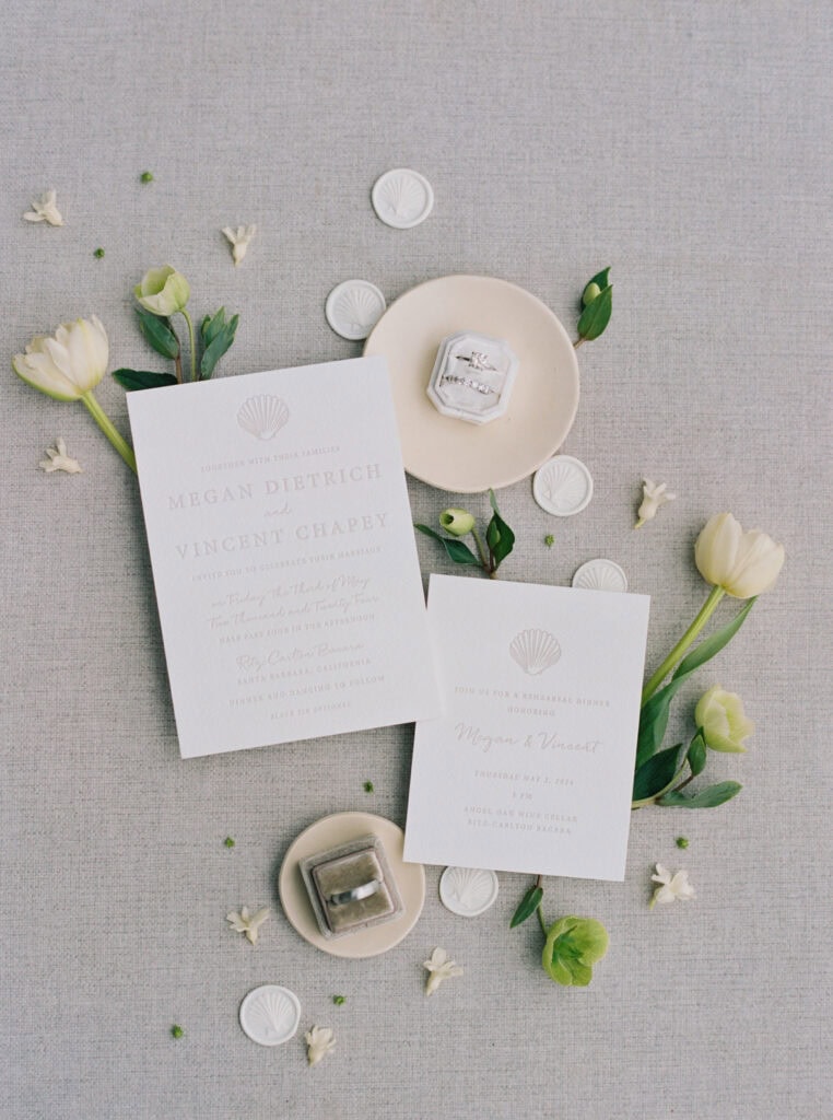 Elegant wedding invitation suite with modern type and calligraphy, delicate floral details, and soft neutral tones, styled with fresh blooms—perfect inspiration for a Santa Barbara luxury wedding.