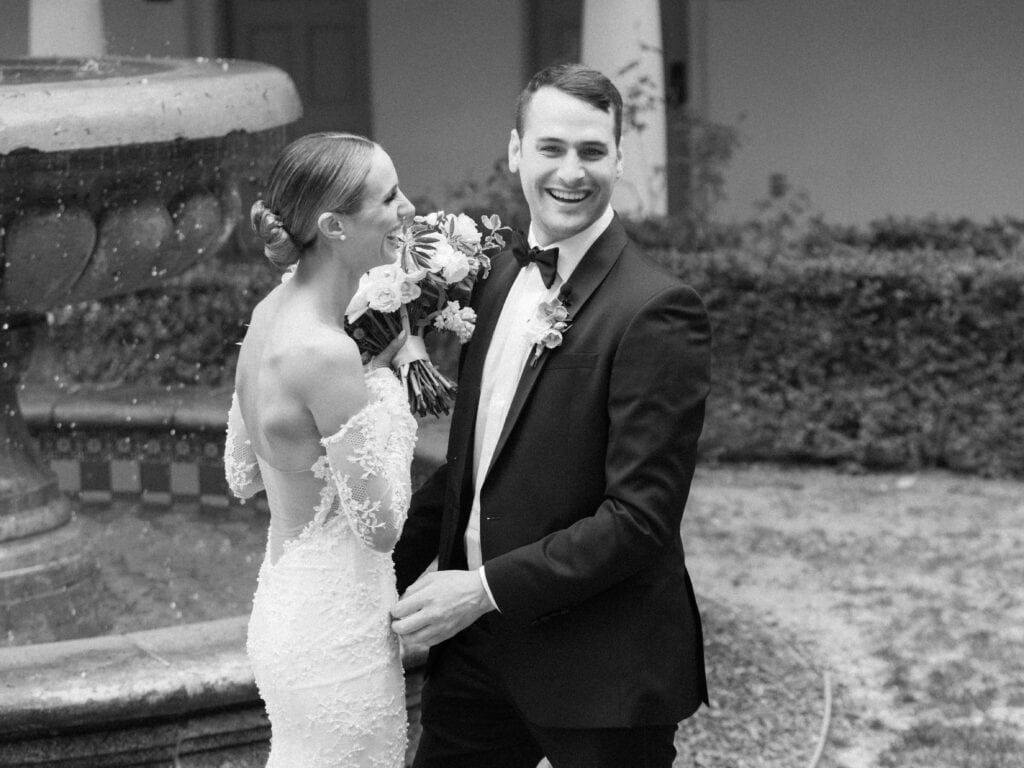 Emotional black and white photo of a groom's first look at his bride, capturing a timeless and heartfelt moment before their Santa Barbara wedding ceremony